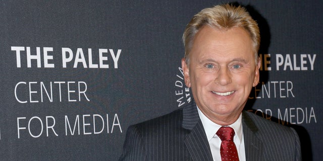 Pat Sajak in gray suit on red carpet