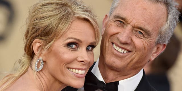 rfk jr.  and cheryl hines beaming on the red carpet