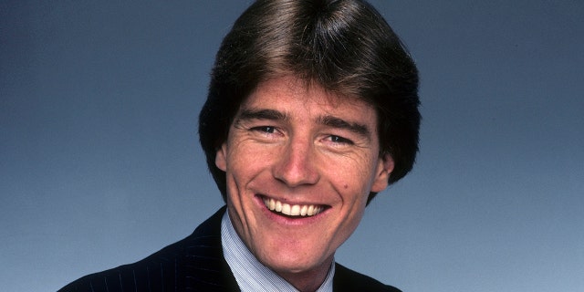 A young Bryan Cranston smiling for a promo shoot in 1983