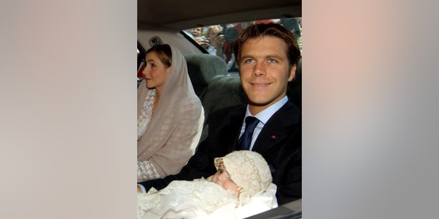 Emanuele Filiberto with his daughter Vittoria inside a car for her christening
