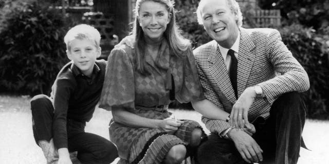 A black and white photo of a young Emanuele Filiberto and his parents