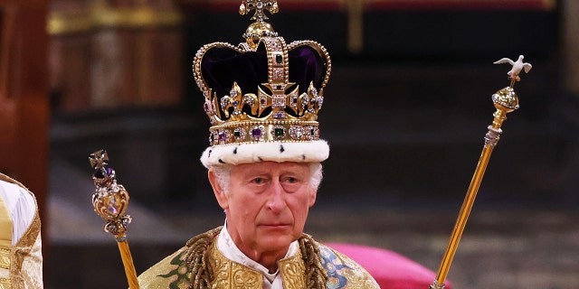 A close-up of King Charles wearing his royal regalia during his coronation