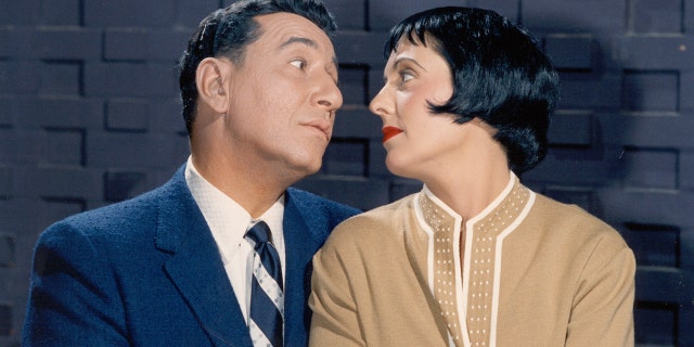 Louis Prima and Keely Smith look adoringly at each other