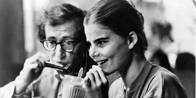 Mariel Hemingway drinking a milkshake next to Woody Allen