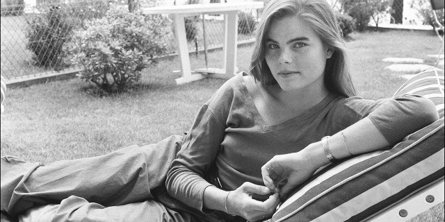 Mariel Hemingway lying down in a black and white photo