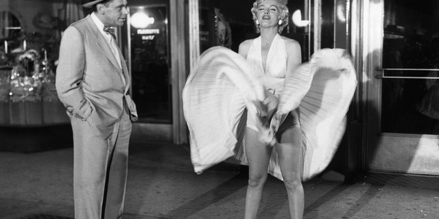 Tom Ewell and Marilyn Monroe in a scene from the movie The Seven Year Itch.