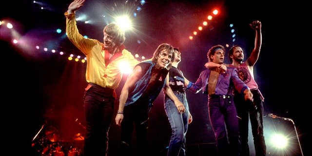 The band Journey performing on stage during the '80s