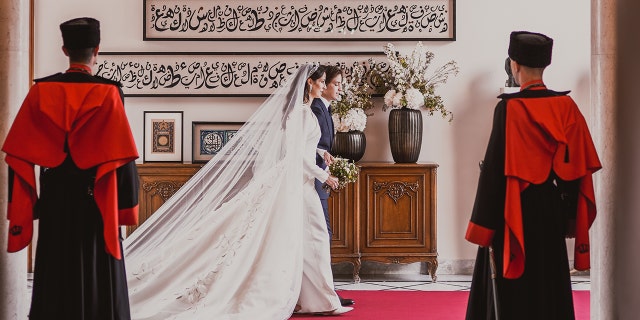 Royal family of Jordan walking to the side on their wedding day