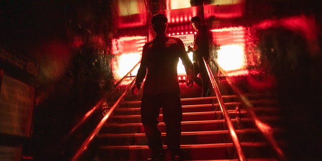 Zak Bagans going down the stairs of the Comedy Store