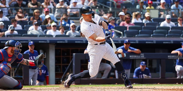 Giancarlo Stanton swings