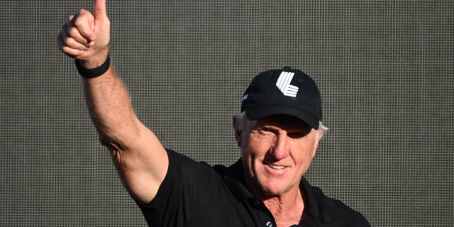 Greg Norman waves