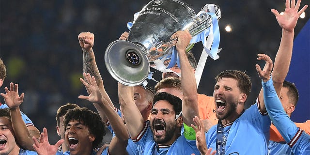 Ilkay Gundogan hoists trophy