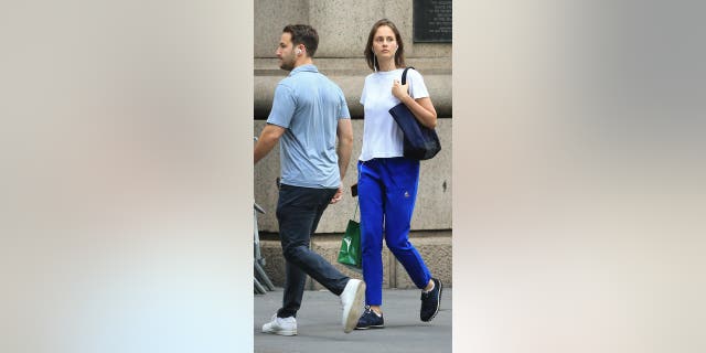 Jeffrey Epstein's last girlfriend Karina Schliak walks with shopping bags