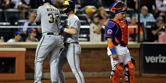 Joey Wiemer is congratulated by Jesse Winker
