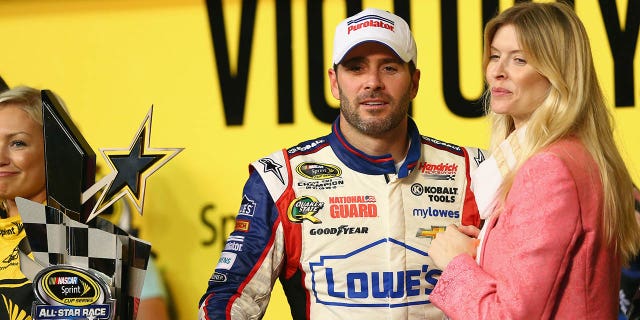 Jimmie Johnson and his wife Chandra pose for a picture