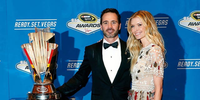 Jimmie Johnson and his wife Chandra pose for a photo