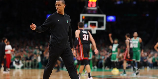 Joe Mazzulla of the Boston Celtics walks on the court