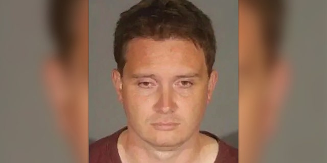 John Alevizos, a Santa Monica DUI suspect, looks down in his mug shot