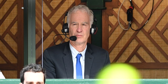 John McEnroe commentates during Wimbledon