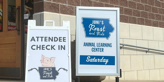 Joni Ernst roast and ride sign
