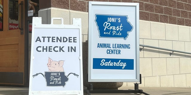 Joni Ernst roast and ride sign