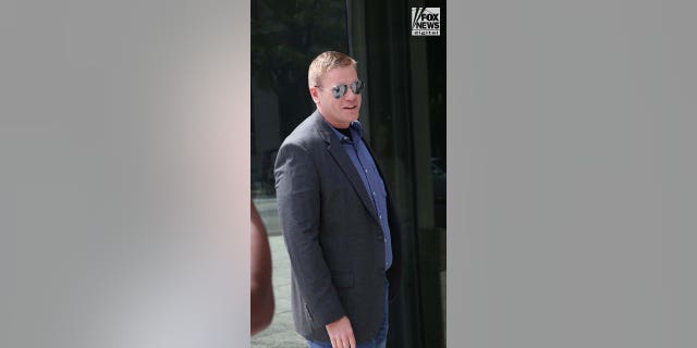 Matt Holloway arrives at court