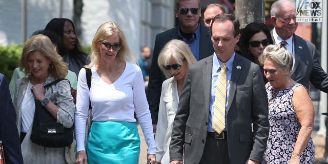 Holloway family and friends walk to the U.S. Attorney's Office