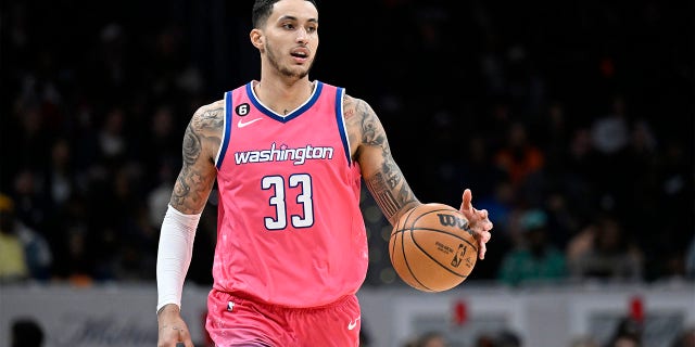 Kyle Kuzma dribbles ball