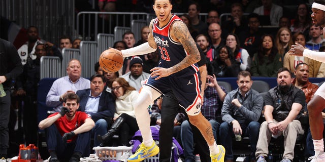 Kyle Kuzma dribbles ball