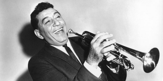 A close-up of Louis Prima playing the trumpet