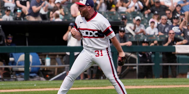 Liam Hendriks celebrates after a big strike out