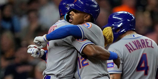 Fransisco Lindor celebrates with Starling Marte