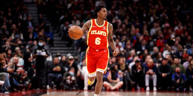 Lou Williams dribbles up court