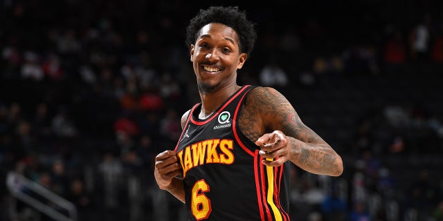 Lou Williams poses for camera