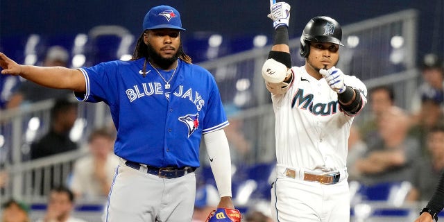Luis Arraez celebrates after hit