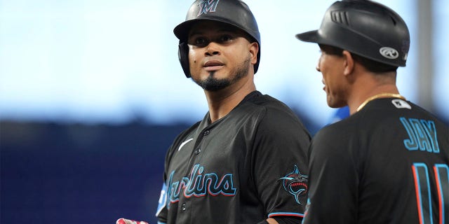Luis Arraez stands on first base