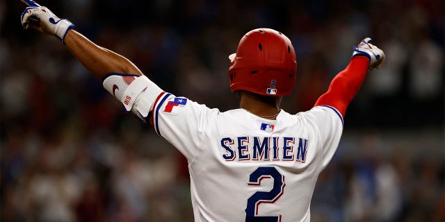 Marcus Semien celebrates after hitting double