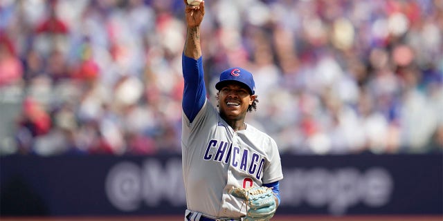 Marcus Stroman holds ball in the air