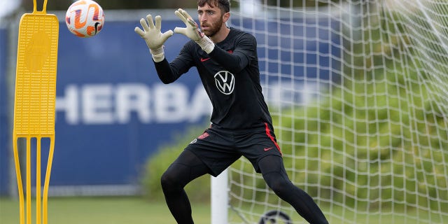 Matt Turner makes a save at practice