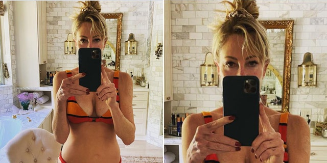 Melanie Griffith posing in front of a mirror in a bikini