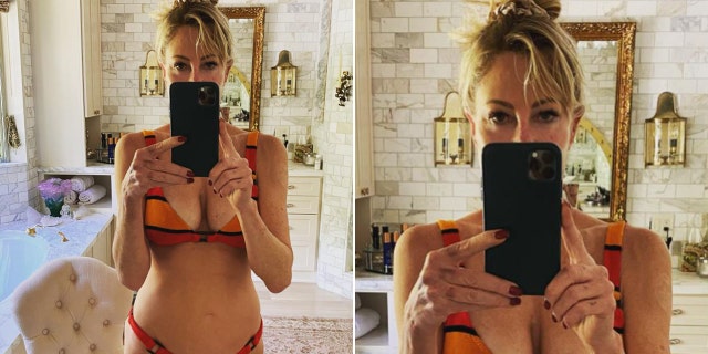 Melanie Griffith posing in front of a mirror in a bikini