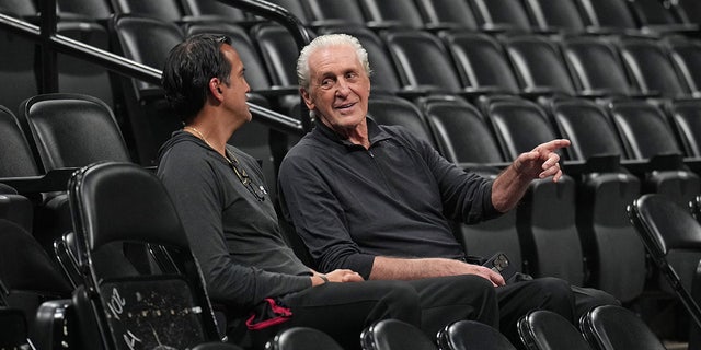 Erik Spoelstra and Pat Riley talk during a Miami Heat practice