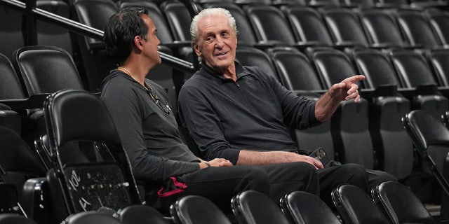 Erik Spoelstra and Pat Riley talk during a Miami Heat practice