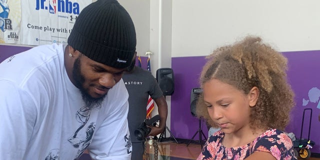 Micah Parsons with child
