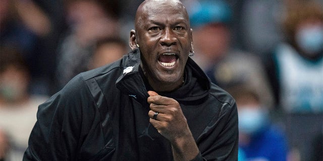 Michael Jordan looks on during game