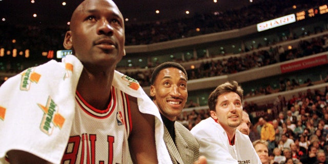Michael Jordan and Scottie Pippen sit on the bench