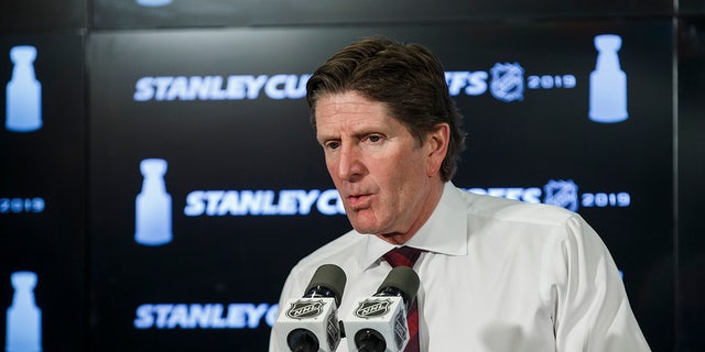 Mike Babcock talks to the media