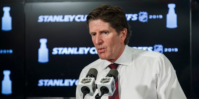 Mike Babcock talks to the media