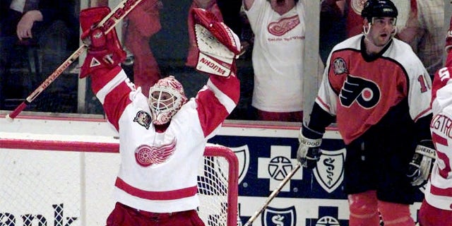 Mike Vernon celebrates after winning Stanley Cup