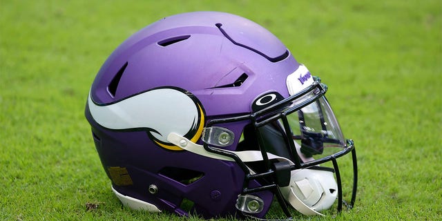 Minnesota Vikings helmet sits on the turf